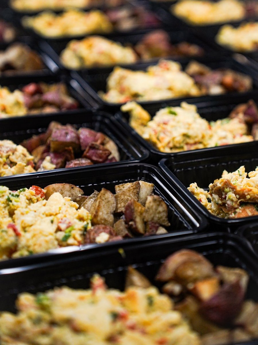 Rows of prepared Fresh Fit Meals trays